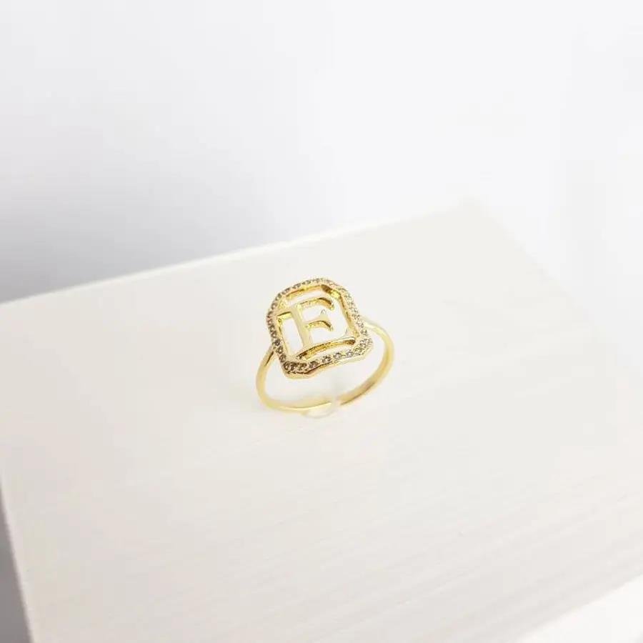 ANEL 1,6CM RETANGULAR CRAV/VAZADA COM LETRA E LISA