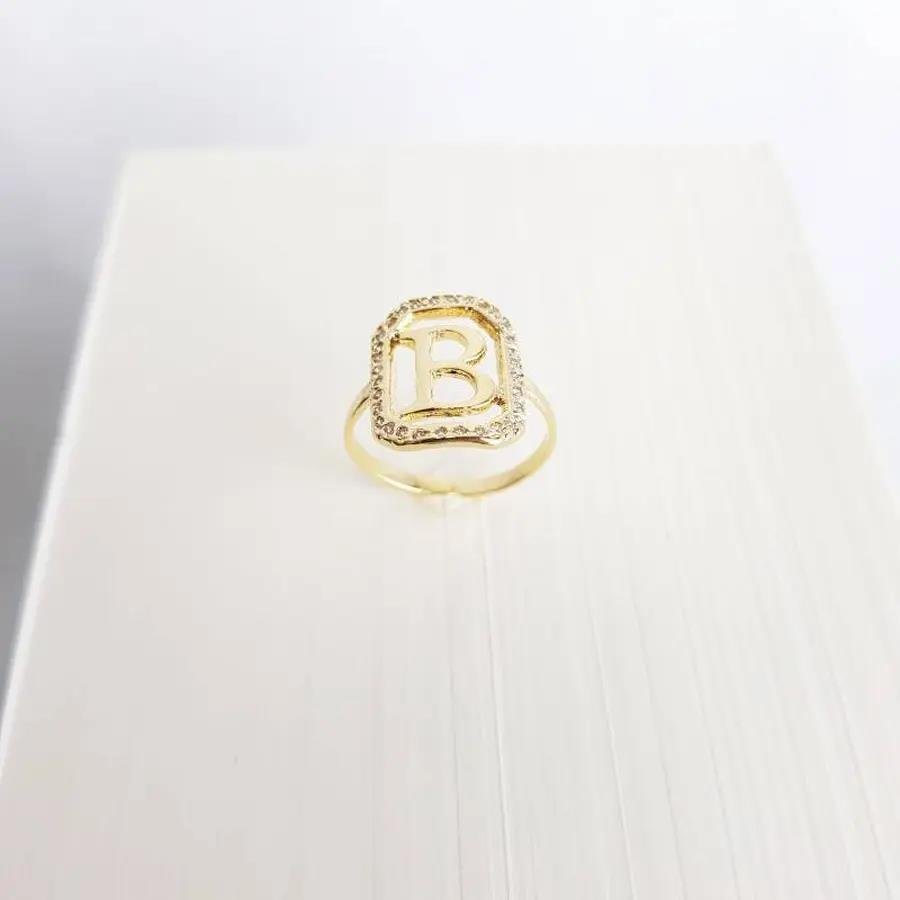 ANEL 1,6CM RETANGULAR CRAV/VAZADA COM LETRA R LISA