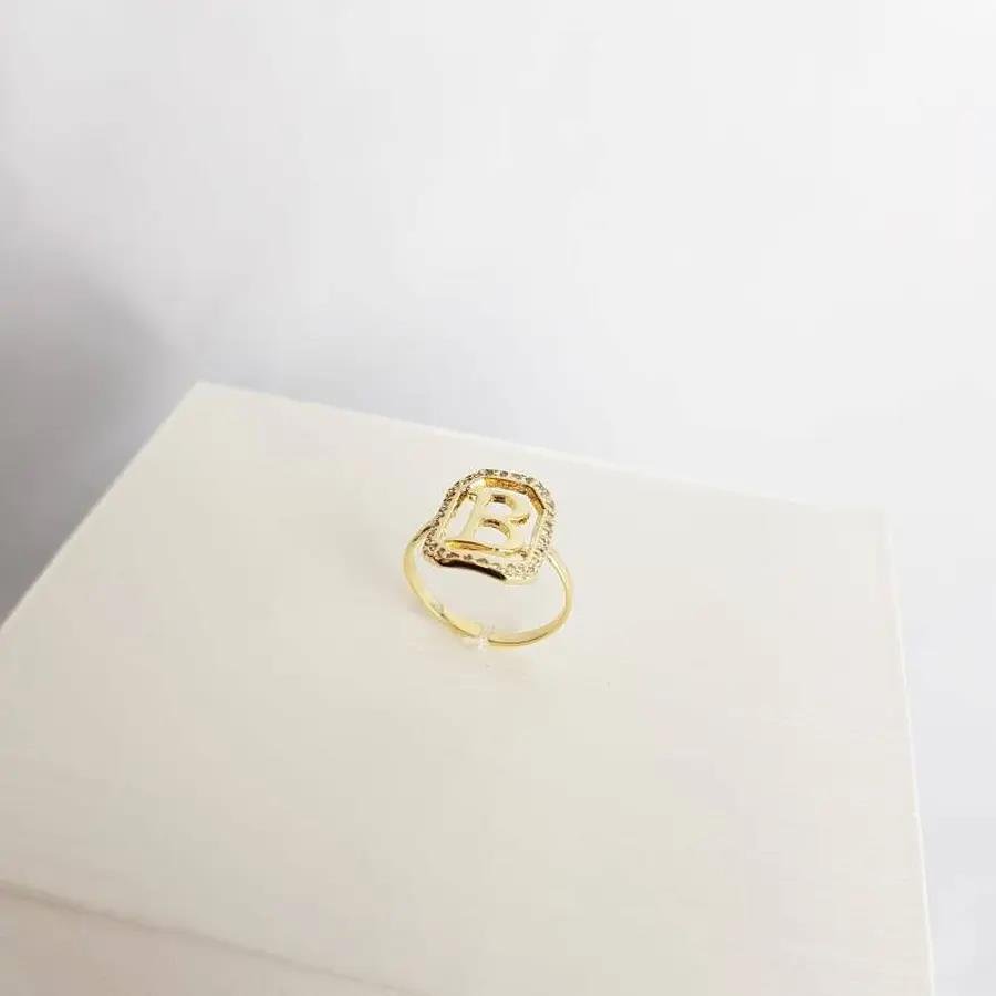 ANEL 1,6CM RETANGULAR CRAV/VAZADA COM LETRA R LISA