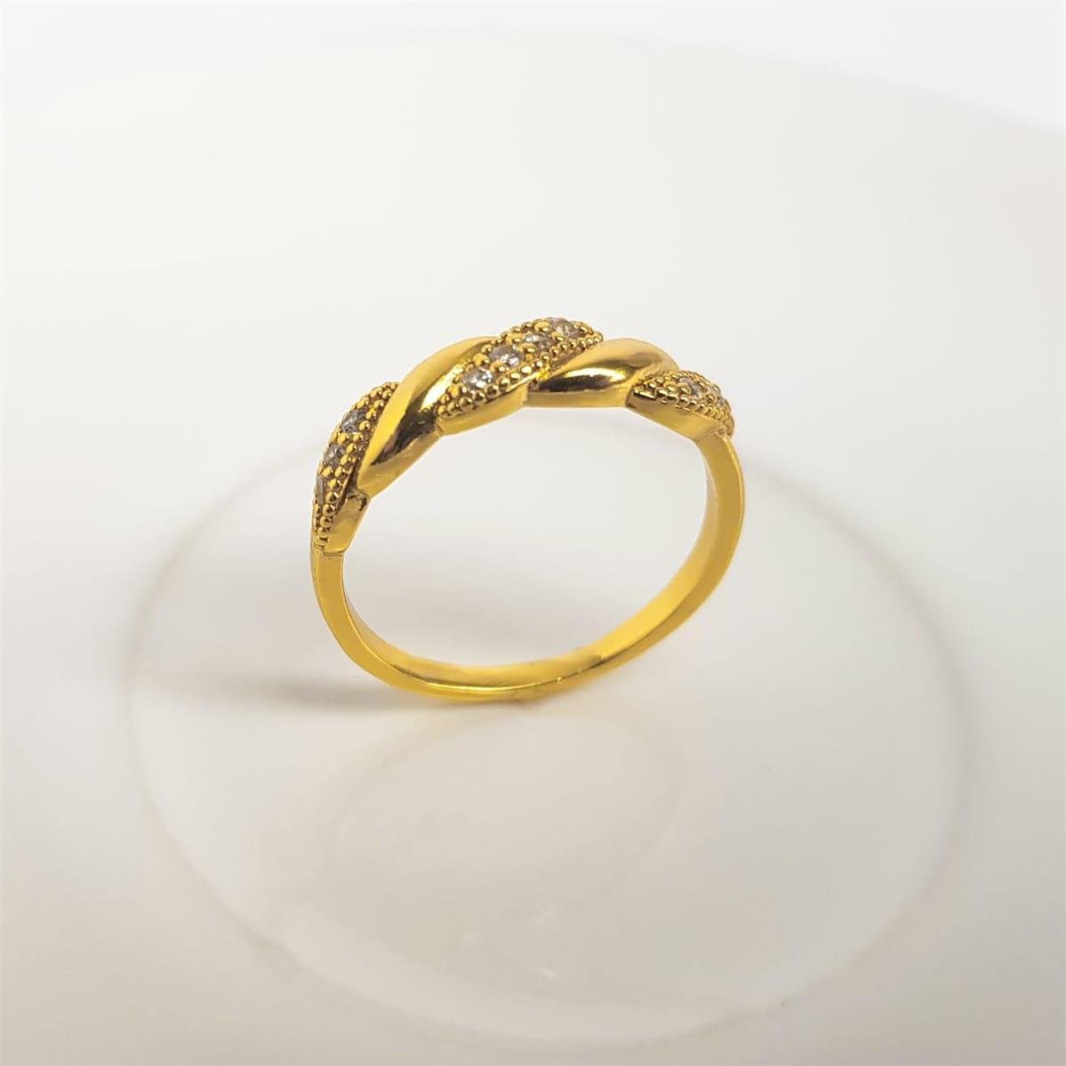 ANEL ENTRELAÇADO INTERCALADO LISO E CRAVEJADO | BANHADO EM OURO 18K