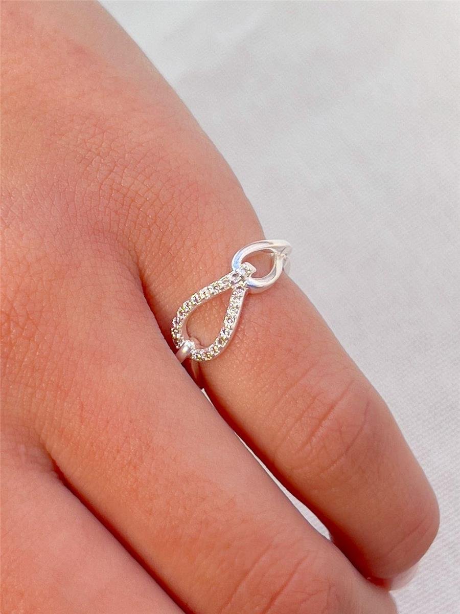 ANEL ARO LISO ENTRELAÇADO EM GOTAS VAZADA CENTRO CRAVEJADO | BANHO DE PRATA